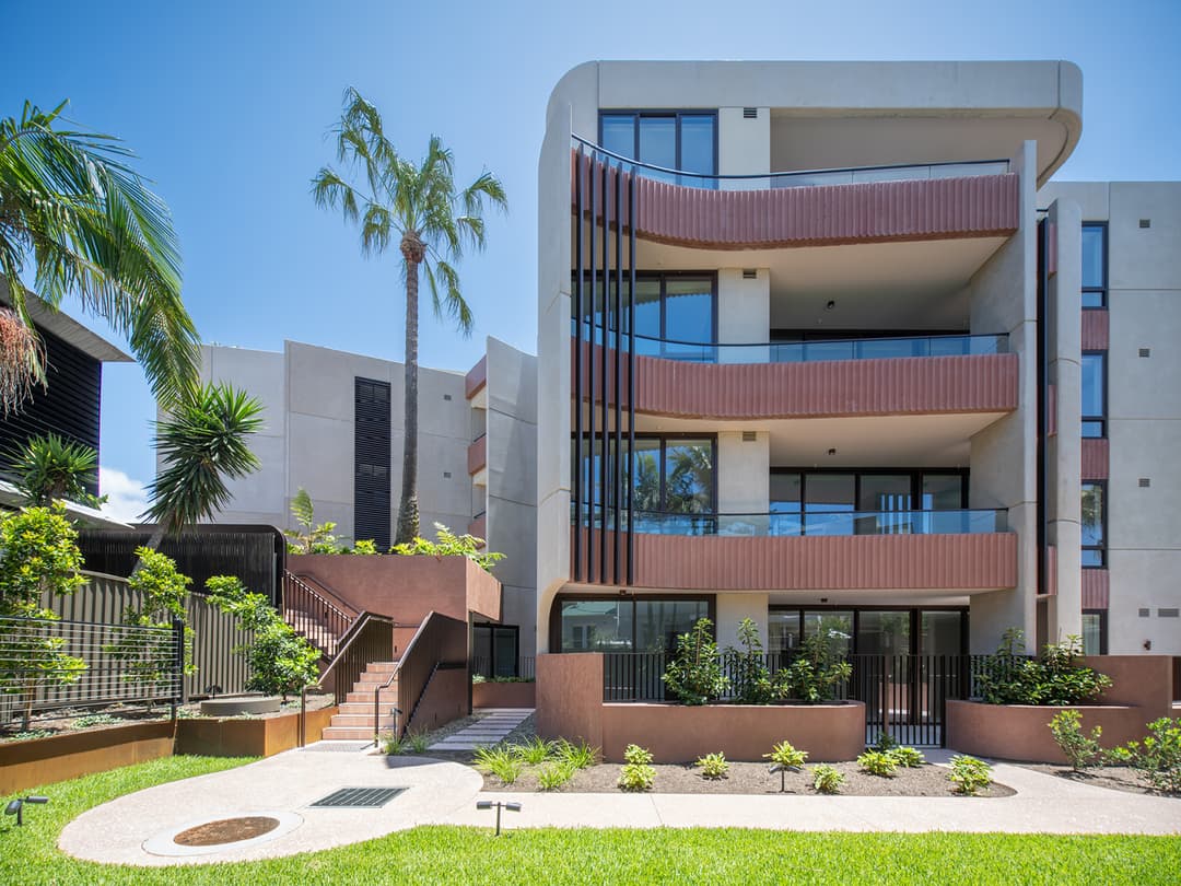 Modern luxury apartment exterior with curved balconies