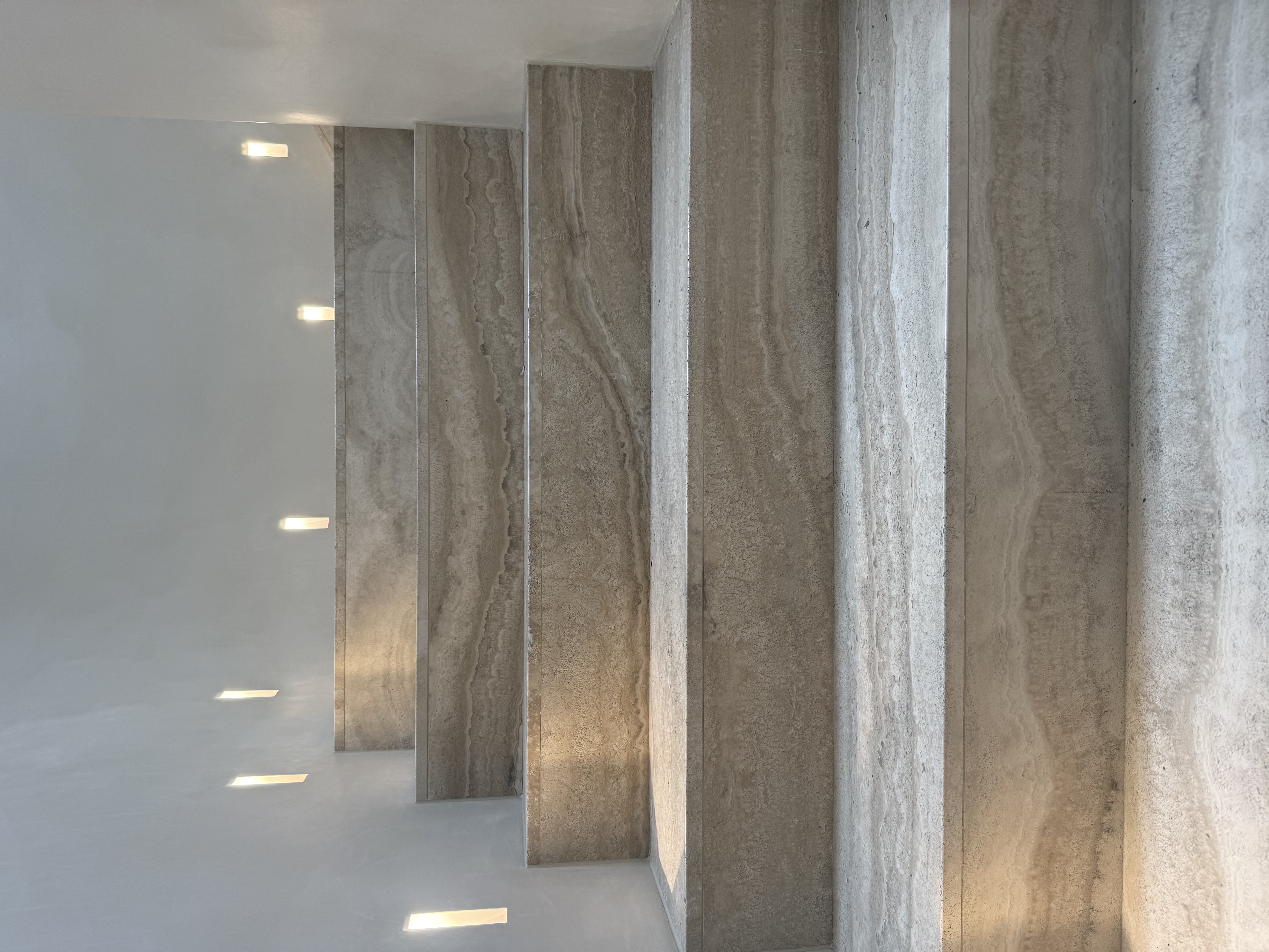 Luxury marble bathroom with professional caulking around columns in Mosman